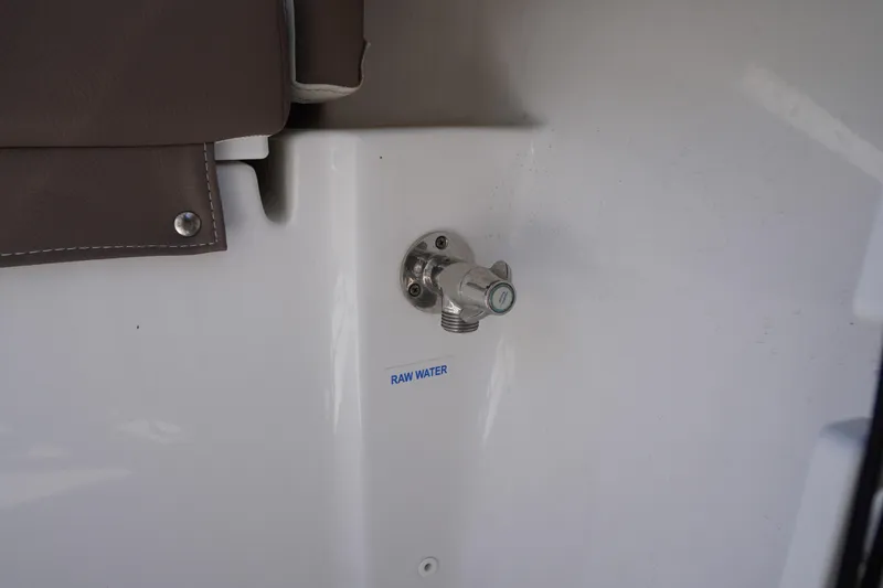 Slide: The Image of 2024 Tidewater 232 LXF boat raw water outlet detail. - 58