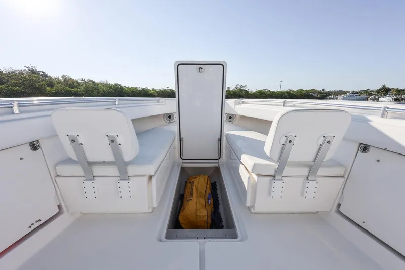 Slide: The Image of 2016 Invincible 39 Open Fisherman boat interior with seating and storage compartment. - 13