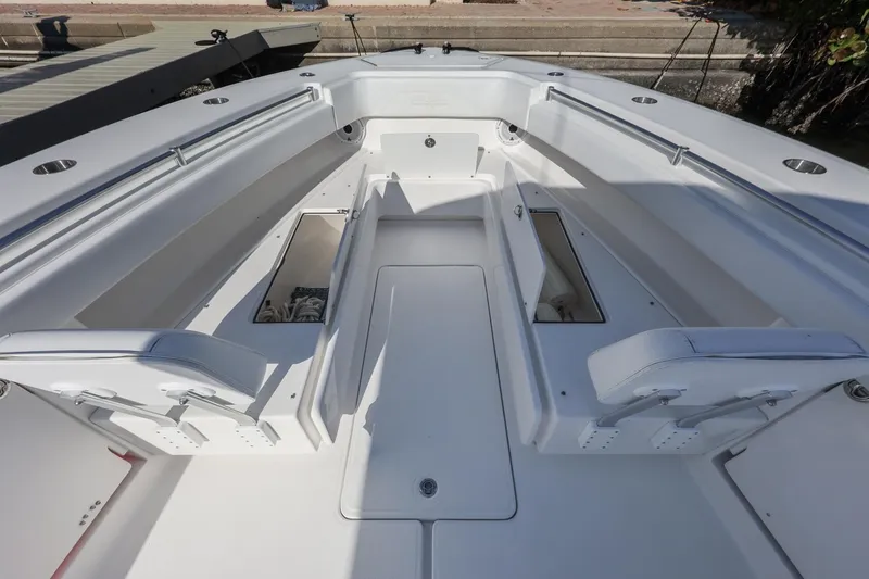 Slide: The Image of 2016 Invincible 39 Open Fisherman boat interior with seating and storage compartments. - 14