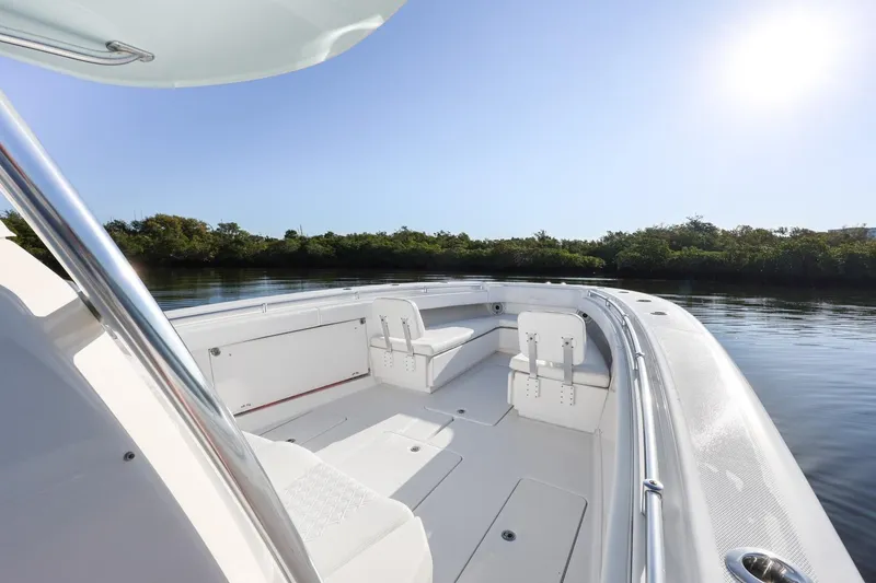 Slide: The Image of 2016 Invincible 39 Open Fisherman boat on calm water, sunny day. - 17