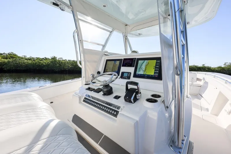Slide: The Image of 2016 Invincible 39 Open Fisherman boat cockpit with modern navigation equipment. - 21