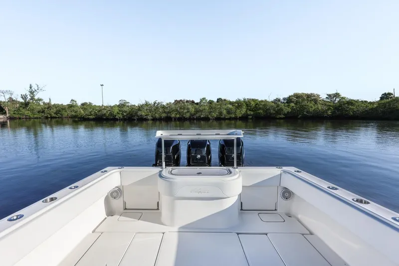 Slide: The Image of 2016 Invincible 39 Open Fisherman boat with triple engines on calm water. - 24