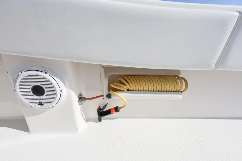 Slide: The Image of 2016 Invincible 39 Open Fisherman boat with speaker and coiled hose detail. - 31