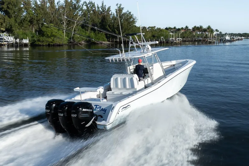 Slide: The Image of 2016 Invincible 39 Open Fisherman boat cruising on a calm waterway. - 36