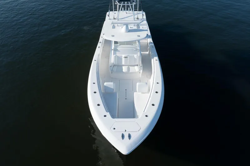 Slide: The Image of 2016 Invincible 39 Open Fisherman boat on calm water, aerial view. - 4