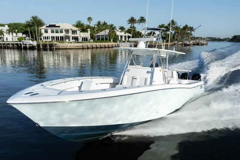 Slide: The Image of 2016 Invincible 39 Open Fisherman boat cruising on a scenic waterway. - 9