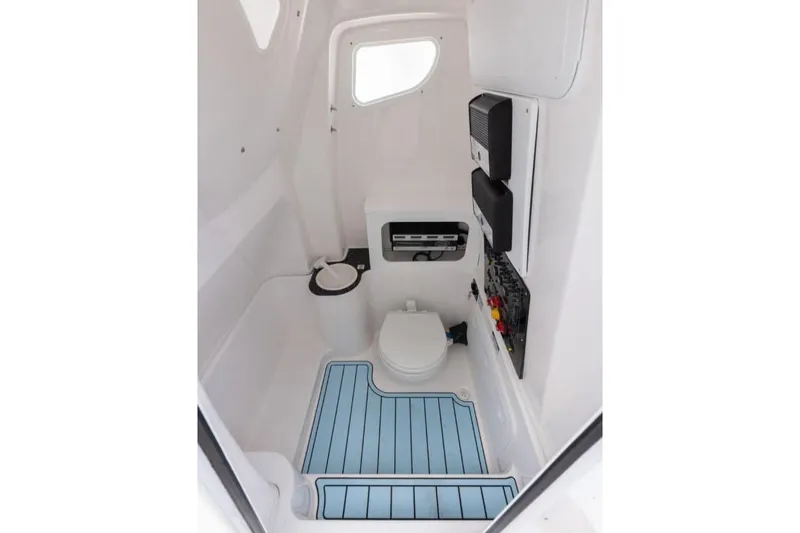 Slide: The Image of Manufacturer Provided Image: Interior of 2025 Sea Fox 288 Commander boat, featuring a compact marine toilet. - 14