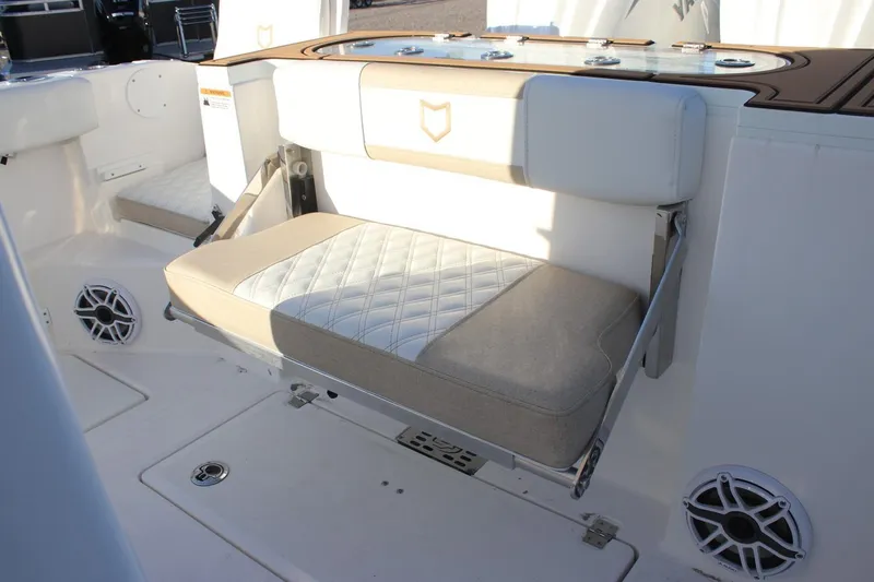 Slide: The Image of 2026 Sea Fox 288 Commander boat interior with foldable seating and speaker system. - 26
