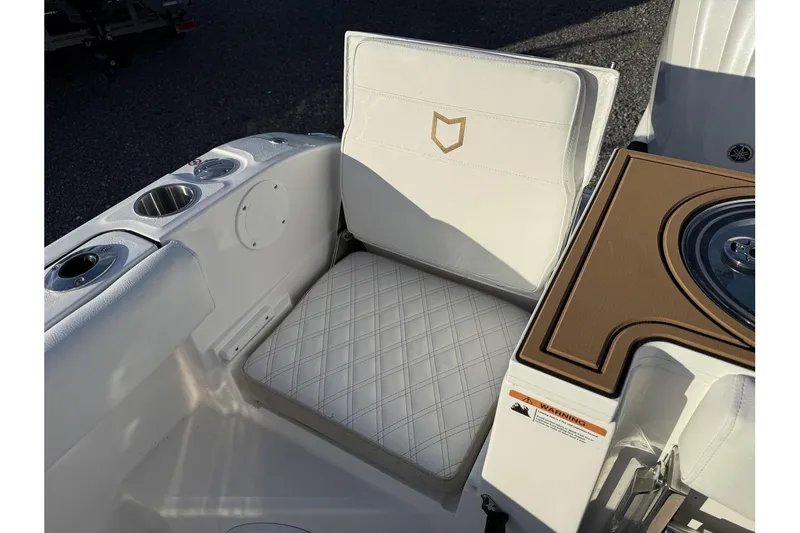 Slide: The Image of 2026 Sea Fox 288 Commander boat interior with cushioned seating and cup holders. - 30