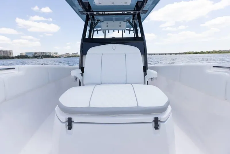 Slide: The Image of Manufacturer Provided Image: 2025 Sea Fox 288 Commander boat interior with white seating on a calm water backdrop. - 7