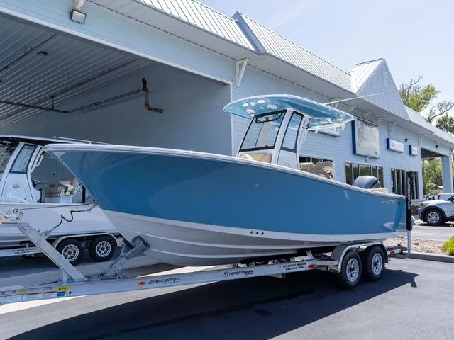 Slide: The Image of 2026 Sportsman Heritage 231 Center Console on trailer outside building. - 10