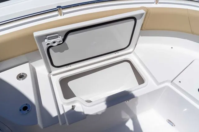 Slide: The Image of Open storage compartment on Sportsman Heritage 231 Center Console 2026. - 13