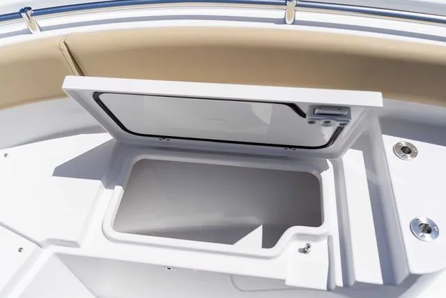 Slide: The Image of Open storage compartment on Sportsman Heritage 231 Center Console 2026. - 15