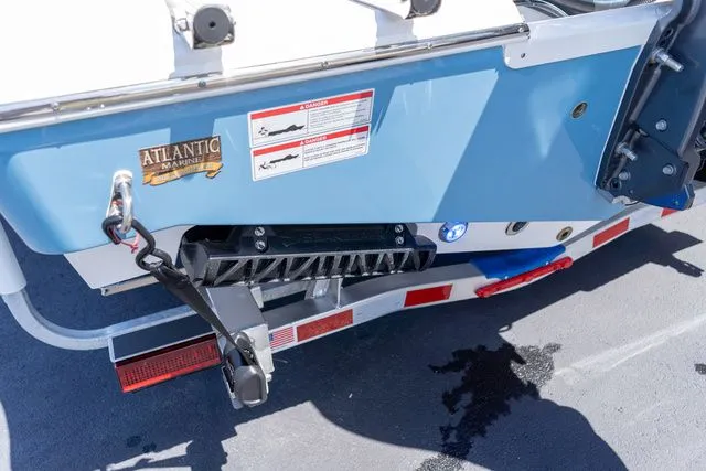 Slide: The Image of Rear view of a 2026 Sportsman Heritage 231 Center Console boat. - 18