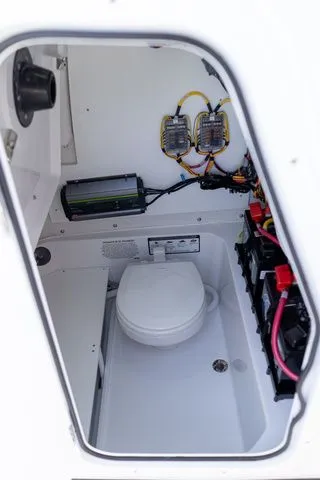 Slide: The Image of Interior of Sportsman Heritage 231 Center Console 2026 with electronics and toilet. - 33