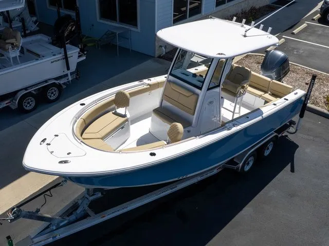 Slide: The Image of 2026 Sportsman Heritage 231 Center Console on trailer, blue and white design. - 6