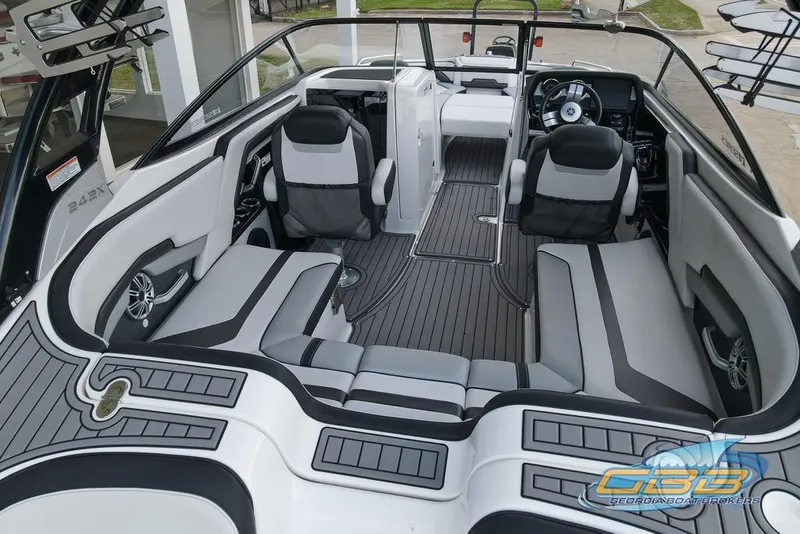 Slide: The Image of 2017 Yamaha Boats 242X E-Series interior with sleek seating and modern dashboard design. - 12