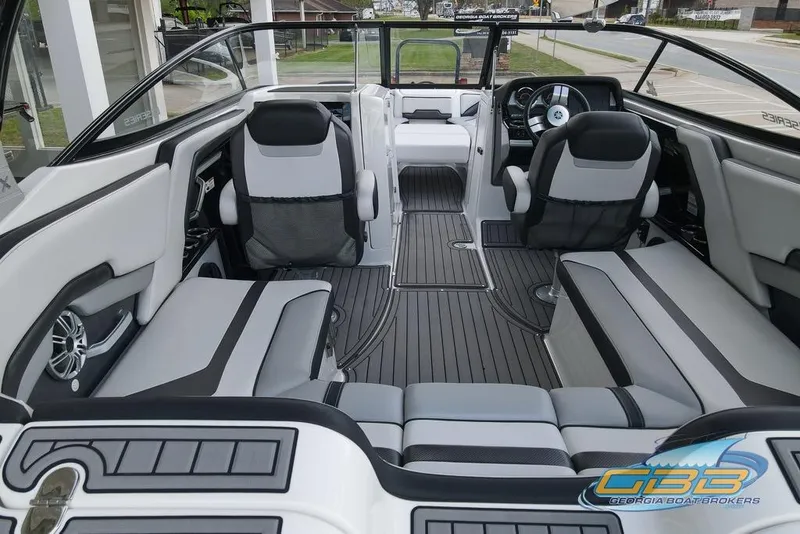 Slide: The Image of Interior of 2017 Yamaha Boats 242X E-Series, featuring sleek seating and modern design. - 13