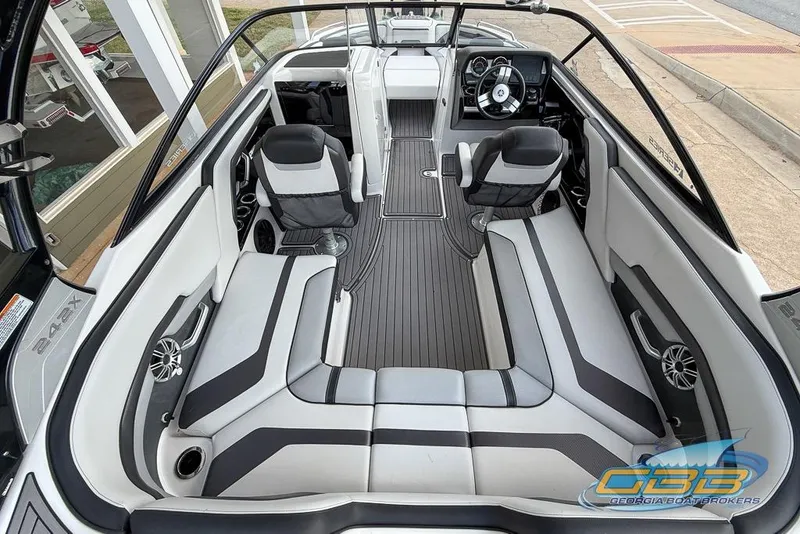 Slide: The Image of 2017 Yamaha Boats 242X E-Series interior with sleek seating and modern dashboard design. - 15