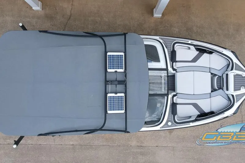 Slide: The Image of Overhead view of 2017 Yamaha Boats 242X E-Series with solar panels on cover. - 17