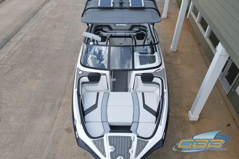 Slide: The Image of 2017 Yamaha Boats 242X E-Series, aerial view, sleek design, spacious seating, modern features. - 18