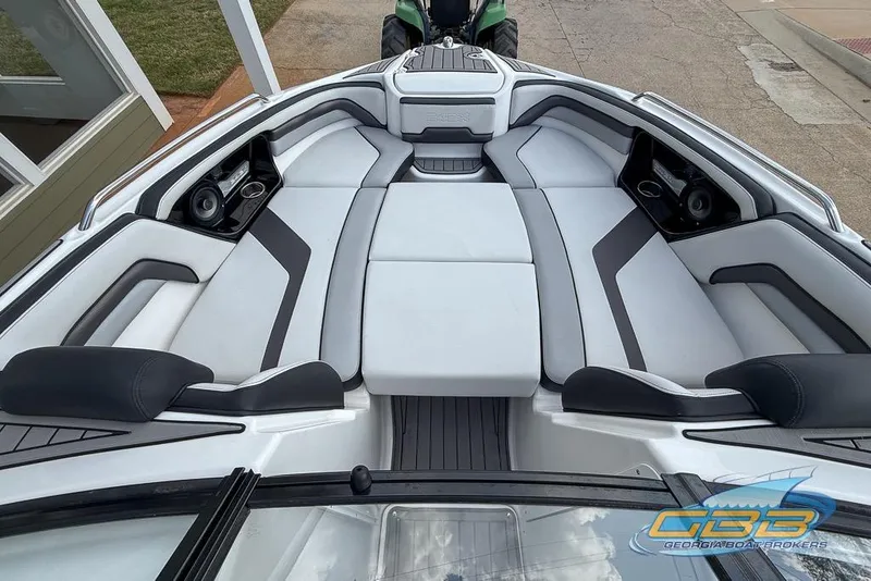 Slide: The Image of Interior view of 2017 Yamaha Boats 242X E-Series, featuring sleek seating and audio system. - 20