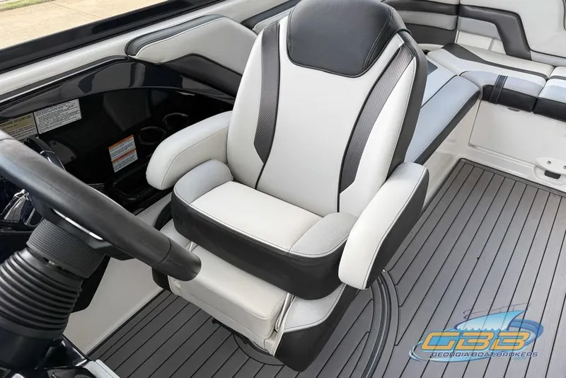 Slide: The Image of 2017 Yamaha Boats 242X E-Series interior with steering wheel and seating. - 24