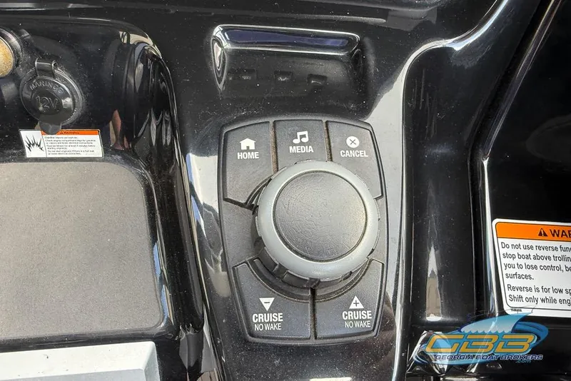 Slide: The Image of Control panel of 2017 Yamaha Boats 242X E-Series with media and cruise buttons. - 27