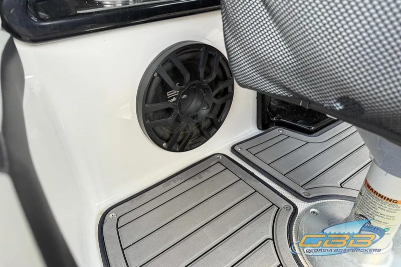 Slide: The Image of 2017 Yamaha Boats 242X E-Series interior speaker and flooring detail. - 36