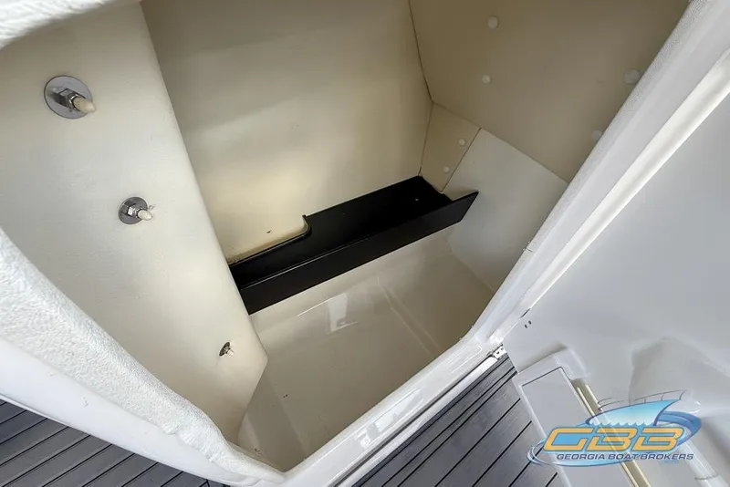 Slide: The Image of Interior storage compartment of 2017 Yamaha Boats 242X E-Series, featuring sleek design. - 37