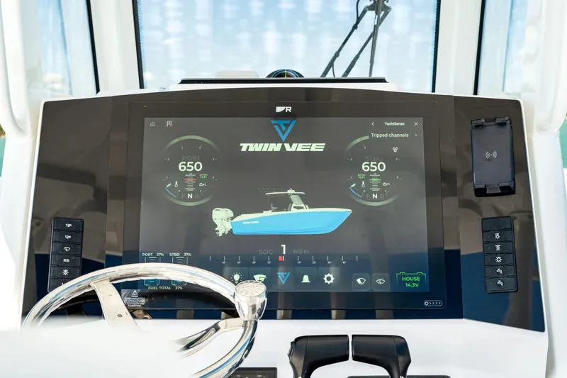 Slide: The Image of 2026 Twin Vee 280 GFX2 CC boat control with digital display. - 11