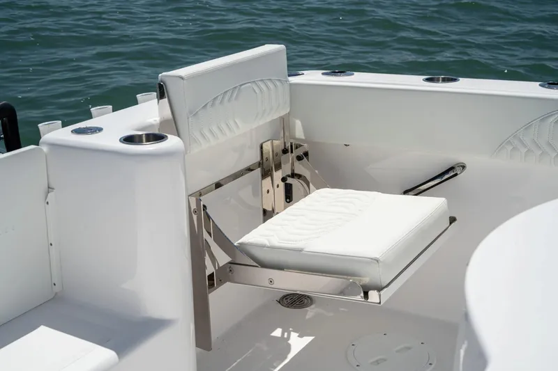 Slide: The Image of 2026 Twin Vee 280 GFX2 CC boat seat by the water. - 15