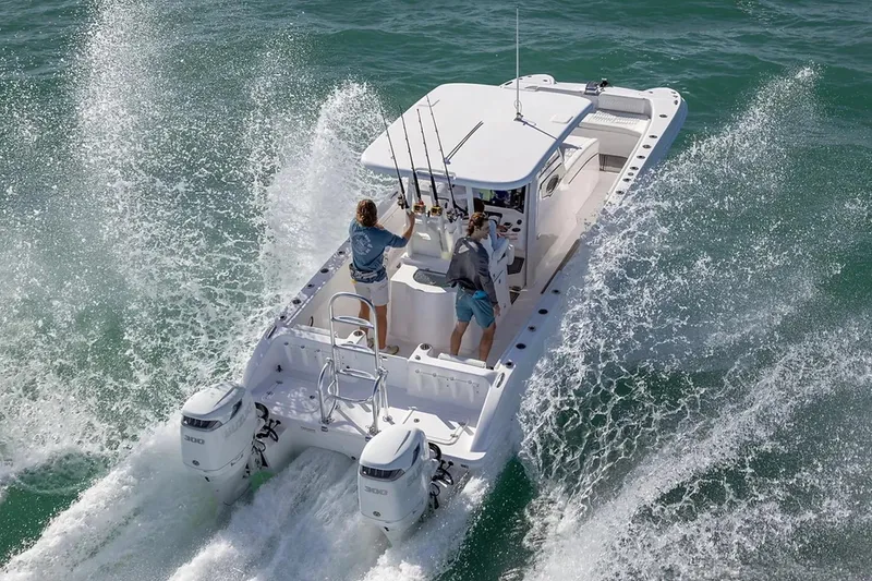 Slide: The Image of Manufacturer Provided Image: Twin Vee 280 GFX2 CC 2026 cruising on ocean with two people onboard. - 2