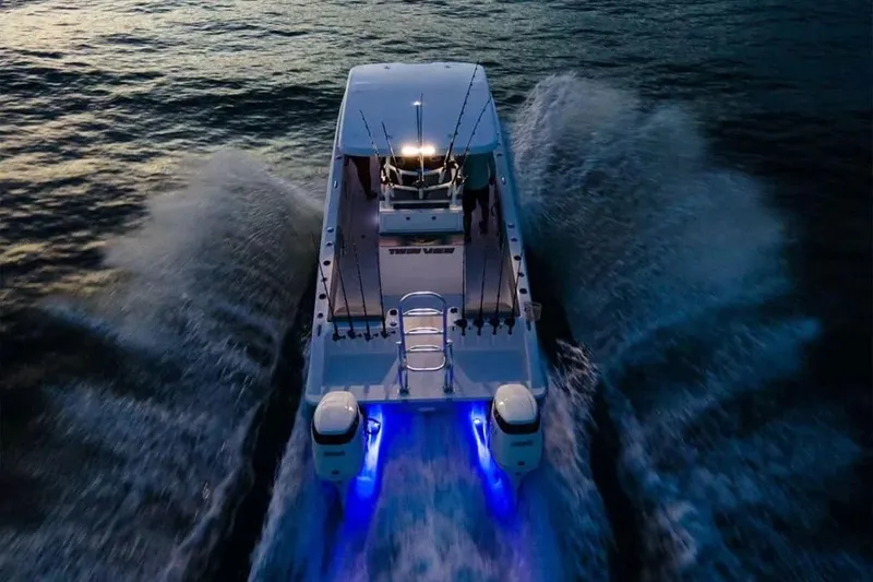 Slide: The Image of 2026 Twin Vee 280 GFX2 CC boat cruising at sunset. - 26