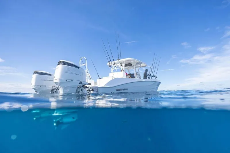 Slide: The Image of 2026 Twin Vee 280 GFX2 CC on open sea, clear blue water. - 28