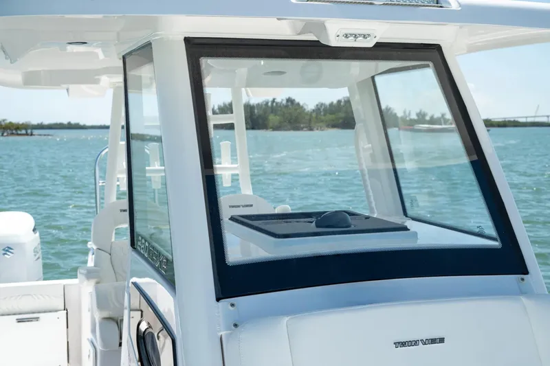 Slide: The Image of 2026 Twin Vee 280 GFX2 CC boat on calm water. - 8