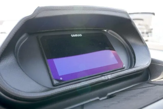 Slide: The Image of Simrad display on 2026 Harris Sunliner 230 boat dashboard. - 14