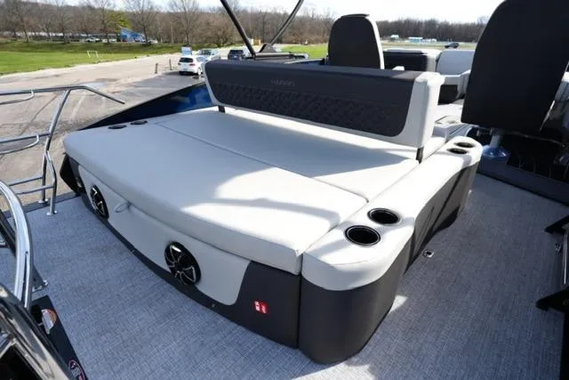 Slide: The Image of 2026 Harris Sunliner 230 boat with spacious seating and cup holders on deck. - 17