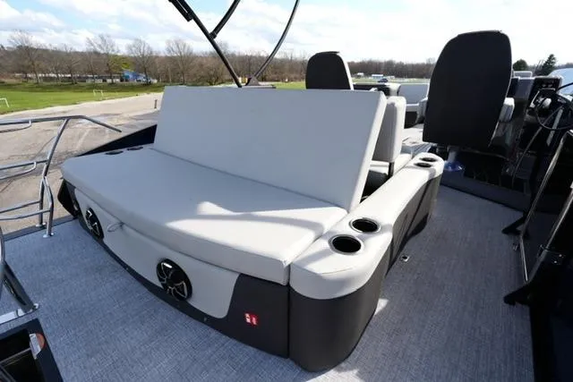 Slide: The Image of 2026 Harris Sunliner 230 boat interior with cushioned seating and cup holders. - 18