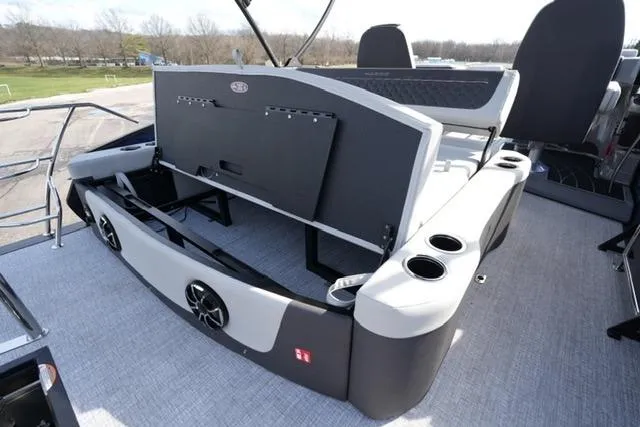 Slide: The Image of 2026 Harris Sunliner 230 boat interior with seating, cup holders, and speakers. - 20