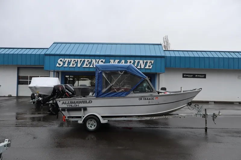 The Image of 2005 Alumaweld Talon 17 boat at Stevens Marine dealership, parked on a trailer. - 1