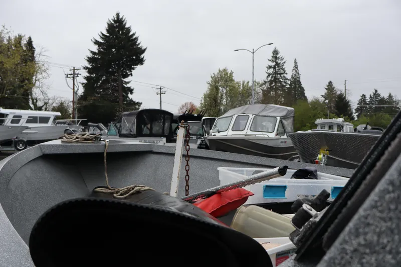 Slide: The Image of 2005 Alumaweld Talon 17 boat with equipment, parked among other boats. - 10
