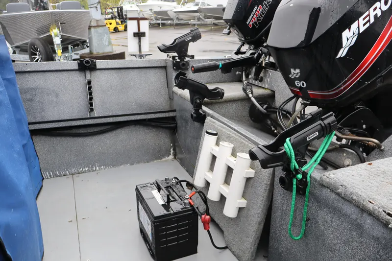 Slide: The Image of 2005 Alumaweld Talon 17 boat interior with Mercury outboard motor and battery setup. - 6