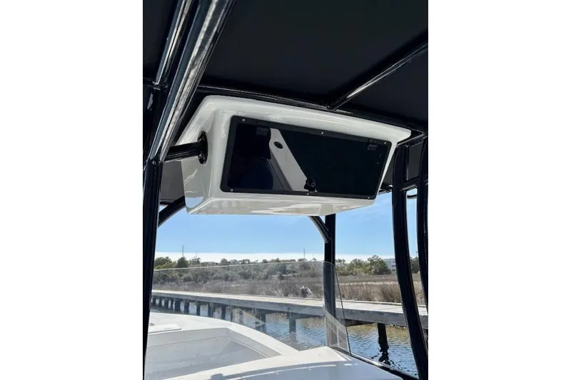 Slide: The Image of 2025 C-Hawk 26 Center Console boat interior with modern console display. - 11