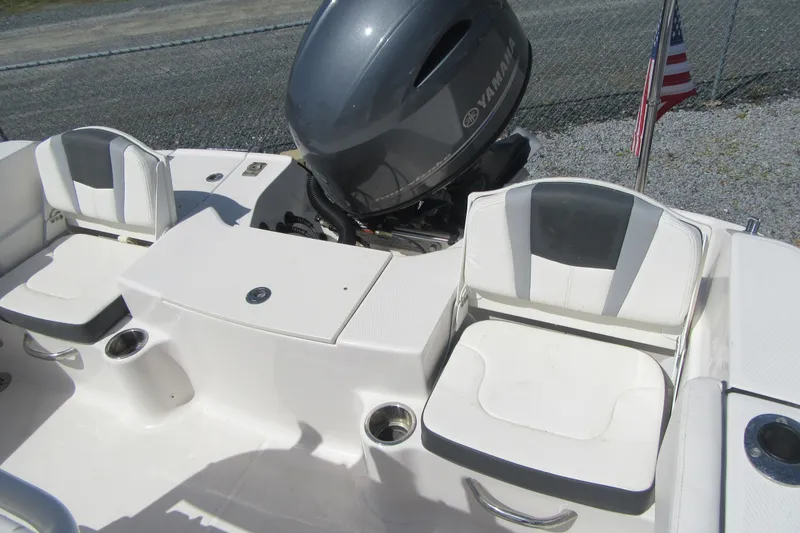 Slide: The Image of 2023 Robalo R180 Center Console boat with Yamaha engine and seating area. - 17