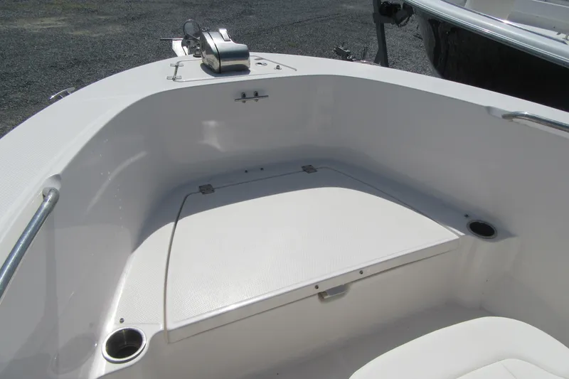 Slide: The Image of 2023 Robalo R180 Center Console boat bow area with storage compartment. - 5