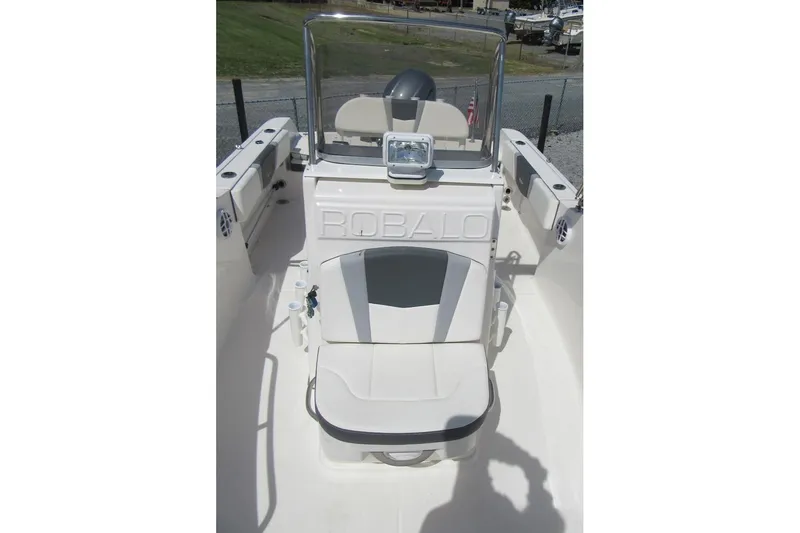 Slide: The Image of 2023 Robalo R180 Center Console boat interior with seating and console view. - 8
