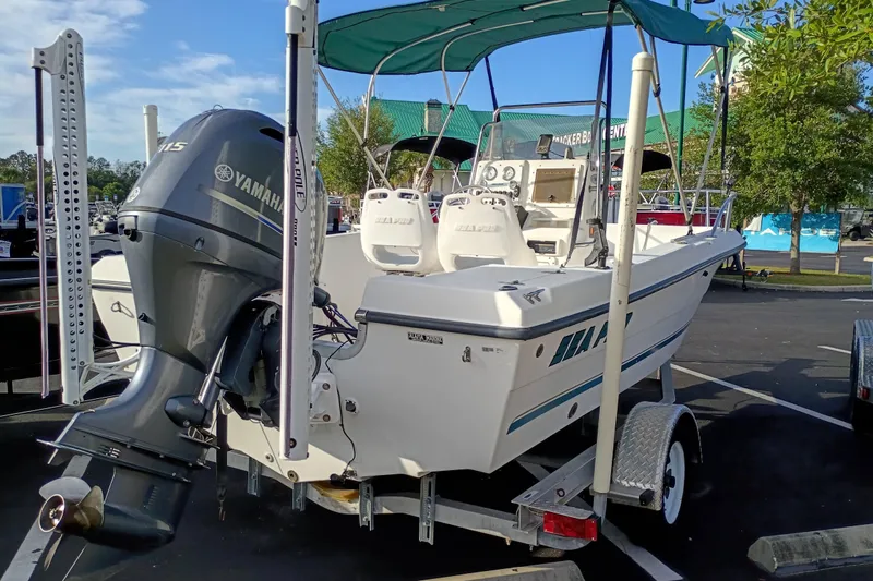 Slide: The Image of 2002 Sea Pro 190 Center Console boat with Yamaha outboard motor on trailer. - 3