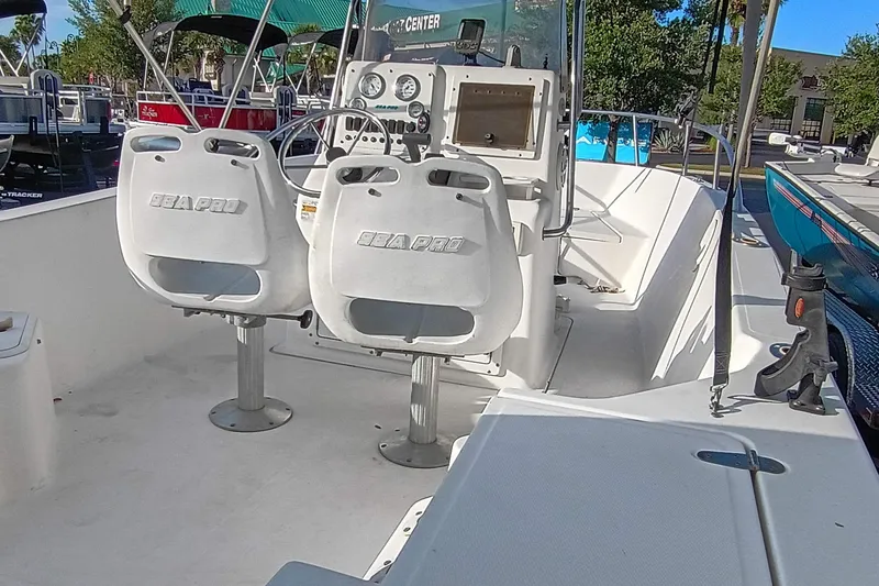 Slide: The Image of 2002 Sea Pro 190 Center Console boat interior with dual seats and control panel. - 5