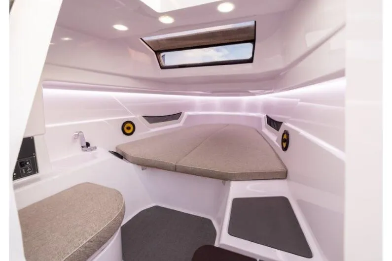 Slide: The Image of Interior cabin of 2027 Axopar 25 Cross Top boat, featuring modern design and comfortable seating. - 4